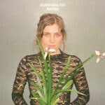 Elisabeth Pixley-Fink Heartskin album cover featuring a woman with flowers and greenery.