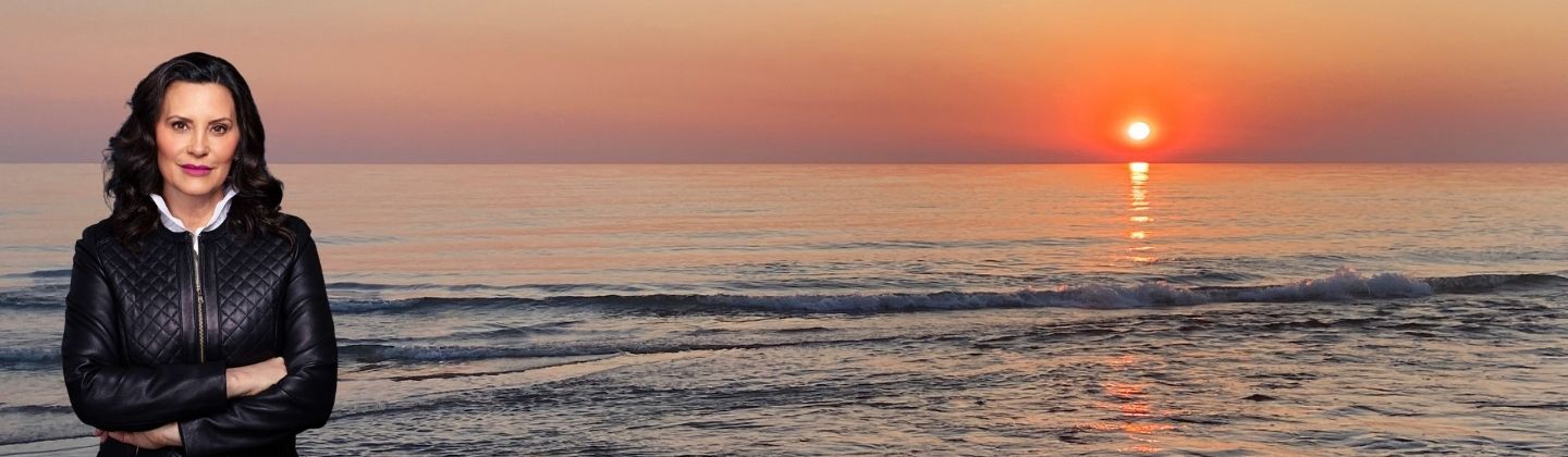 Sunset over Lake Michigan with climate advocate at the shoreline.