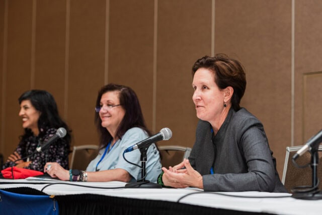 Advocates speaking at Michigan Climate Action Network conference on climate change solutions.