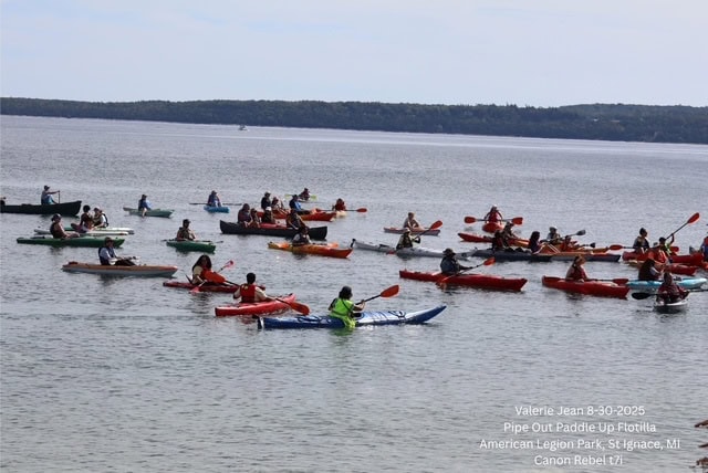 Michigan Climate Action Network logo on kayak paddling event image.