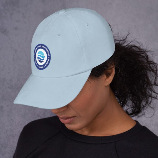 MiCAN Cap logo on light blue baseball cap.
