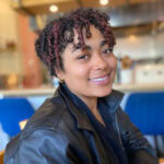 Erica Bouldin smiling in cafe.