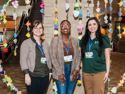 Diverse group of women at Michigan Climate Action Network event promoting environmental sustainability and climate solutions.