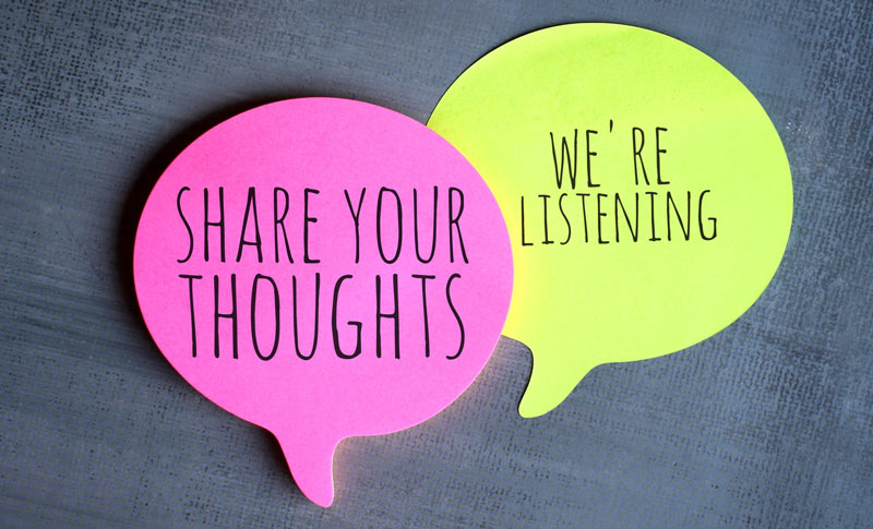 Pink and green speech bubbles with "Share Your Thoughts" and "We're Listening" messages.