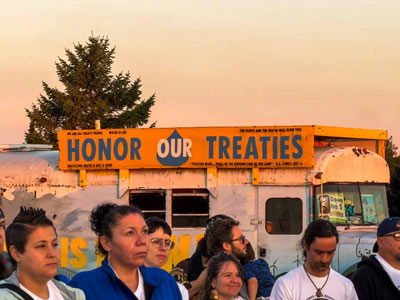 Michigan Climate Action Network banner on bus for environmental advocacy.